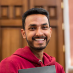 front-view-smiley-man-holding-book_23-2149915900